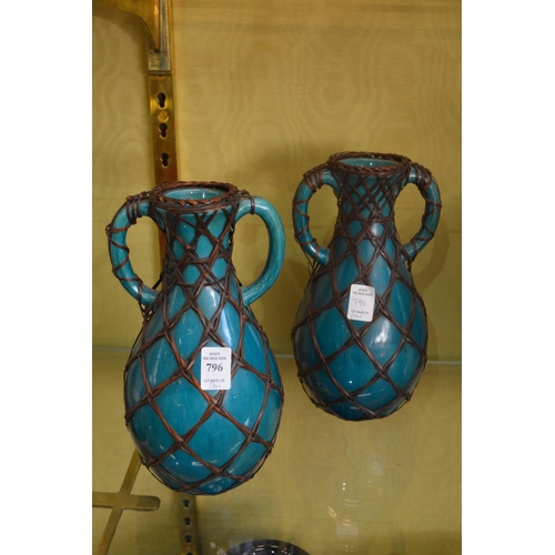 796 - A pair of decorative vases.