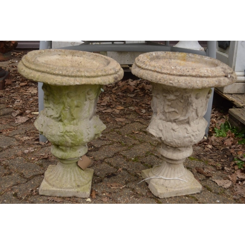 8 - A pair of composite classical urn shaped planters.