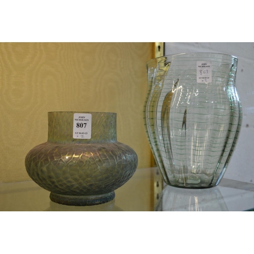 807 - Two iridescent green glass vases.