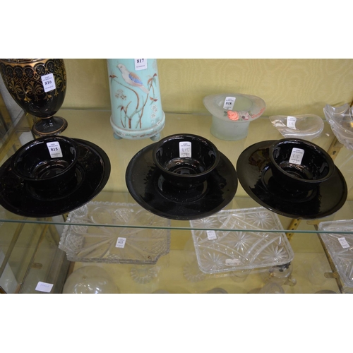 815 - A set of three glass bowls and stands.