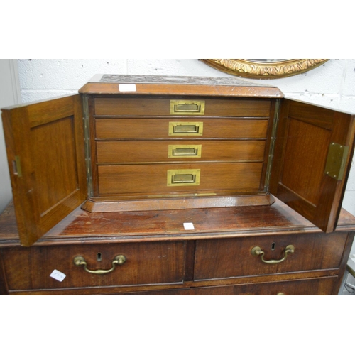 832 - A good Victorian carved walnut two door cutlery canteen or collectors cabinet, the pair of doors ope... 