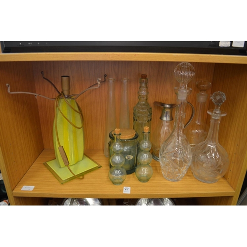 84 - Cut glass decanters and other items to include a decorative lamp.