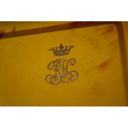 842 - An oval dressing table tray possibly tortoiseshell, inset with a gold monogram and crown.