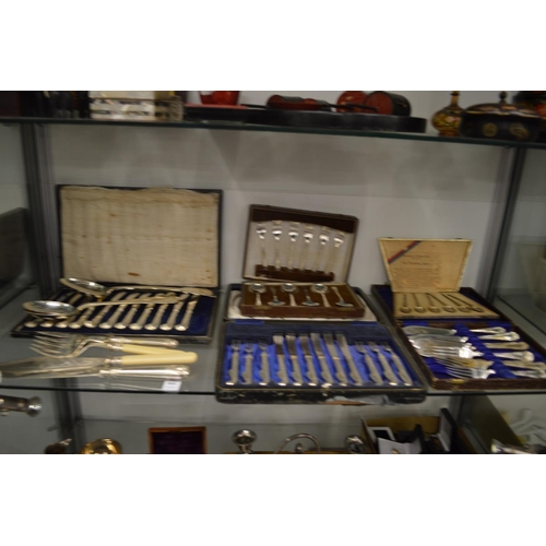 860 - A cased set of six silver handled fruit knives and forks and other flatware, mostly cased.