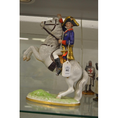 882 - A porcelain model of Napoleon on horseback.