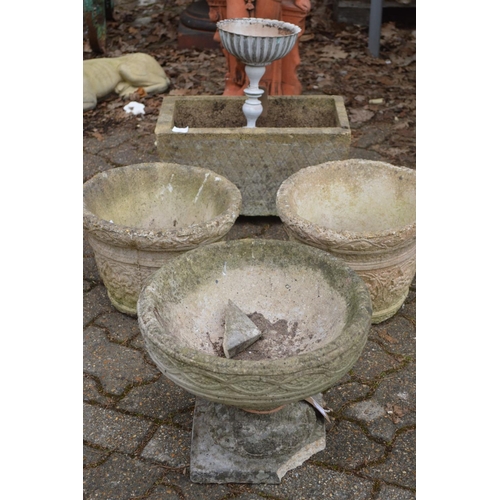 9 - Four various composite garden planters and a small white painted planter.