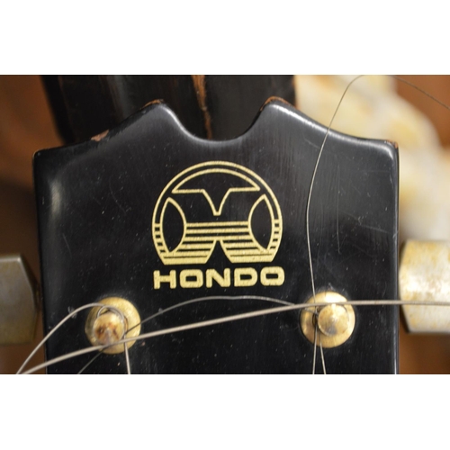 94 - A Hondo electric guitar and case.