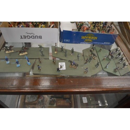 910 - A group of miniature military figures mounted on wooden bases.