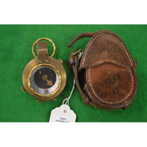 921 - A leather cased military compass.