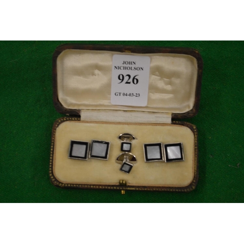 926 - A cased pair of mother of pearl cufflinks with matching studs.