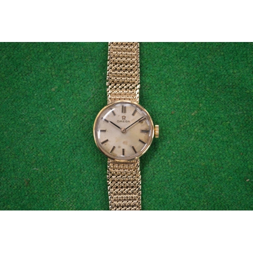 931 - A Ladies 9 carat gold Omega wristwatch with 9 carat gold strap.