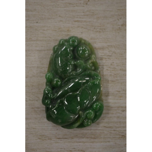 937 - A Chinese carved jade amulet.