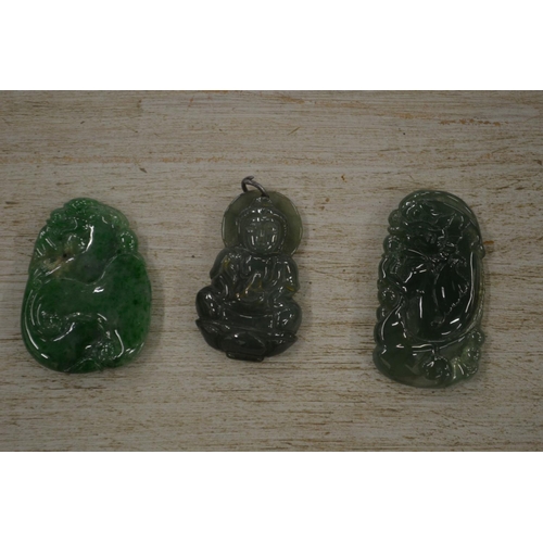 939 - Three Chinese carved jade amulets.