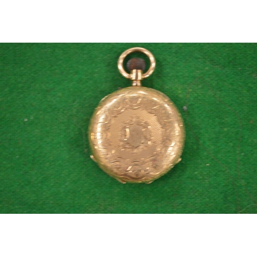 958 - A Ladies engraved gold pocket watch stamped 14k.