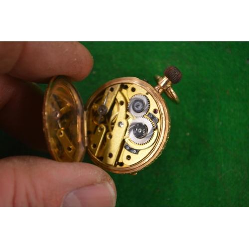 958 - A Ladies engraved gold pocket watch stamped 14k.