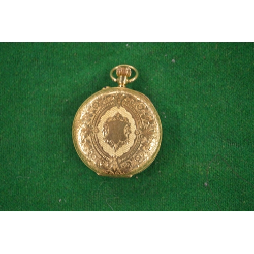 959 - A Ladies engraved gold pocket watch hallmarked 18 carat gold.