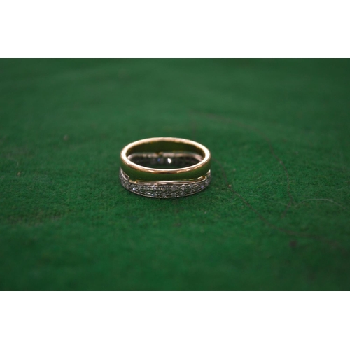 965 - A 18 carat gold and diamond double hoop eternity ring.