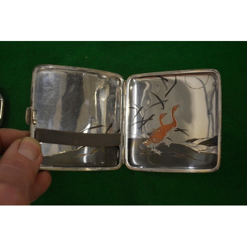 967 - A Japanese silver and mixed metal cigarette case engraved with geese together with a similar compact... 