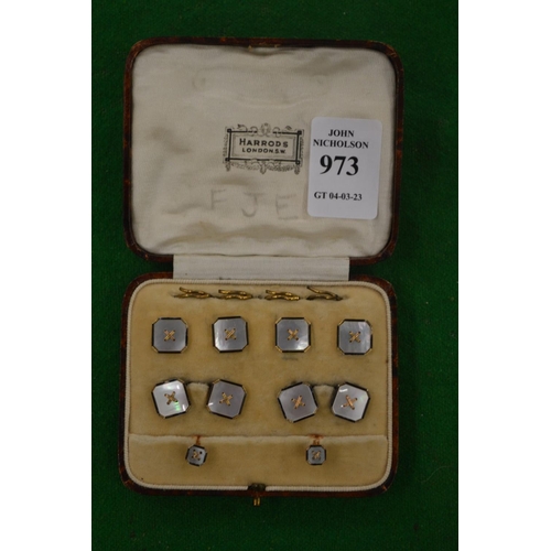 973 - A cased set of cufflinks and dress studs.