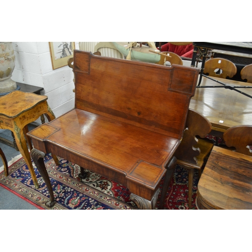 290 - A good George III mahogany fold-over card table of shaped outline on carved cabriole legs with claw ... 