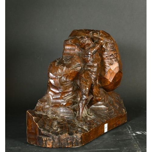 249 - A Continental wood carving of a nude male figure moving a rock bearing figureheads, circa 1900, sign... 