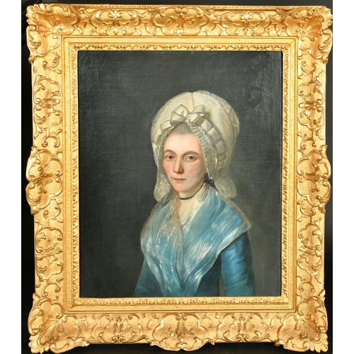 377 - Mid-19th Century Continental School, a half length portrait of a lady in a white bonnet, oil on canv... 