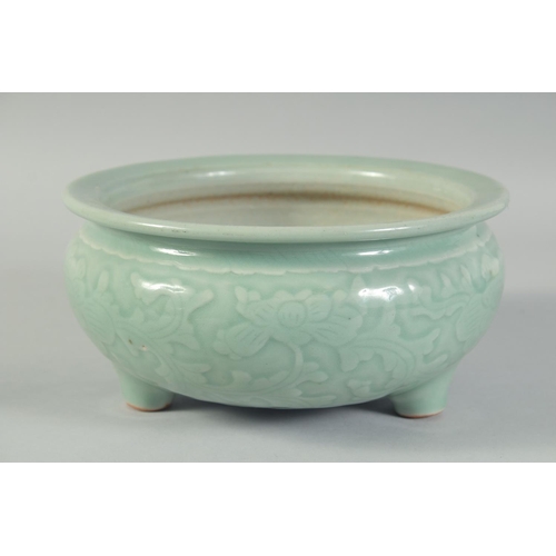 15 - A 19TH CENTURY CHINESE CELADON GLAZE PORCELAIN BOWL / CENSER, with carved floral decoration to the s... 