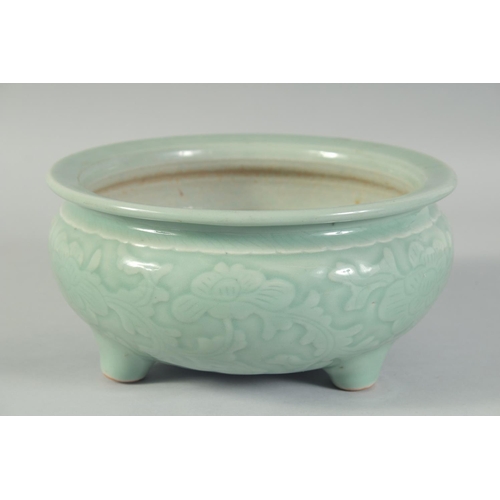 15 - A 19TH CENTURY CHINESE CELADON GLAZE PORCELAIN BOWL / CENSER, with carved floral decoration to the s... 