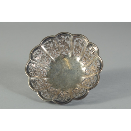16 - A SMALL CHINESE ENGRAVED AND PIERCED SILVER PETAL FORM DISH, on three ball feet, stamped to base, we... 