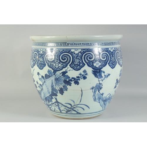 3 - A LARGE 19TH CENTURY CHINESE BLUE AND WHITE PORCELAIN JARDINIERE, painted with birds and flora, (af)... 
