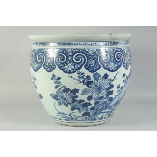 3 - A LARGE 19TH CENTURY CHINESE BLUE AND WHITE PORCELAIN JARDINIERE, painted with birds and flora, (af)... 