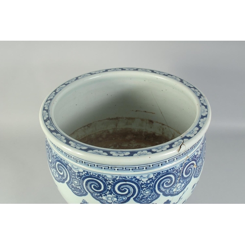 3 - A LARGE 19TH CENTURY CHINESE BLUE AND WHITE PORCELAIN JARDINIERE, painted with birds and flora, (af)... 