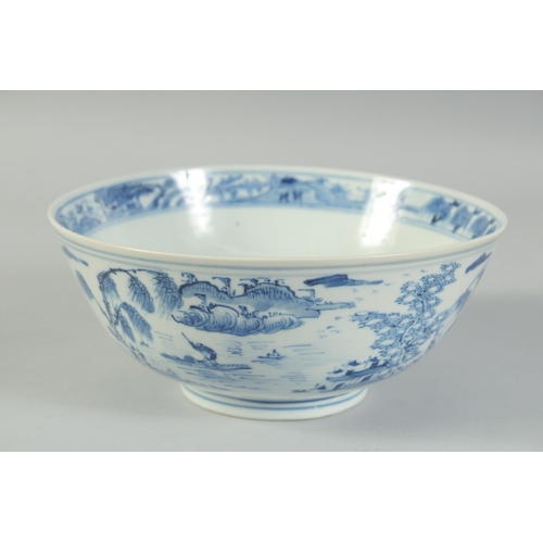 4 - AN EARLY 20TH CENTURY CHINESE BLUE AND WHITE PORCELAIN BOWL, painted with landscape scenes, with fou... 