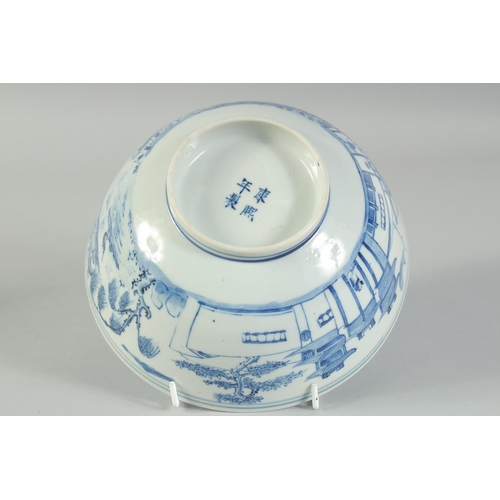 4 - AN EARLY 20TH CENTURY CHINESE BLUE AND WHITE PORCELAIN BOWL, painted with landscape scenes, with fou... 