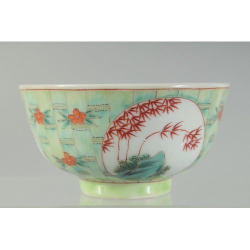 40 - A CHINESE COPPER RED AND GREEN PORCELAIN BOWL, with bamboo and foliate decoration, character mark to... 