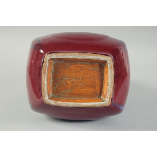 58 - A CHINESE FLAMBE GLAZE TWIN RING HANDLE VASE, 28cm high.