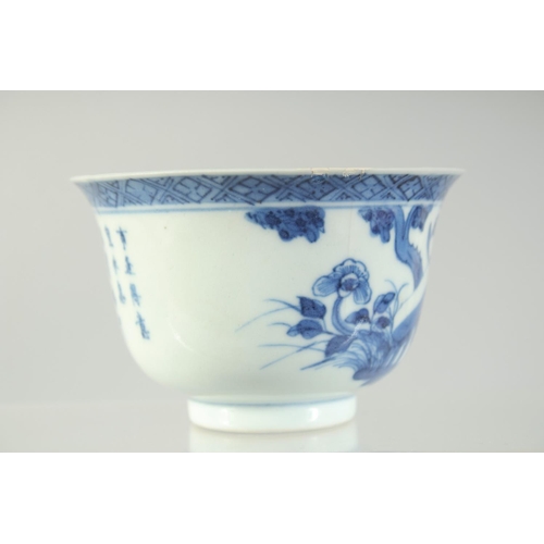 6 - A 19TH CENTURY CHINESE BLUE AND WHITE PORCELAIN TEA BOWL, painted with a bird and flora, the reverse... 