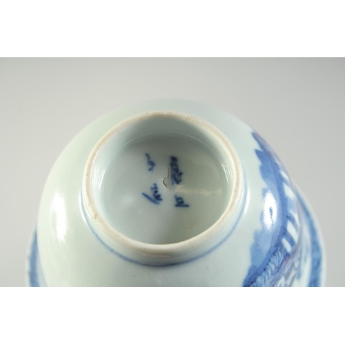6 - A 19TH CENTURY CHINESE BLUE AND WHITE PORCELAIN TEA BOWL, painted with a bird and flora, the reverse... 