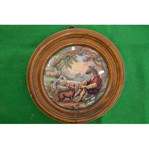 1024 - A porcelain pot lid, The Shepherd Boy, framed.