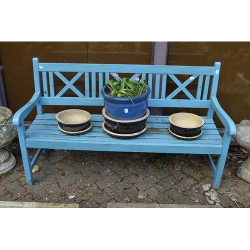 12 - A blue painted garden bench.