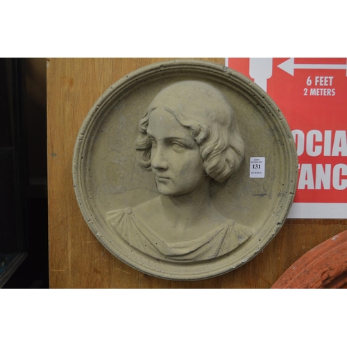 131 - A moulded composite wall plaque modelled with a bust of a young lady.