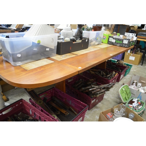 174 - A Danish teak and tile inset extending dining table.