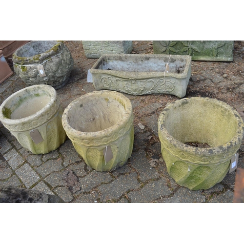 19 - A set of three composite garden planters.