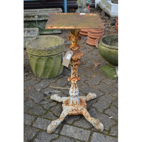 21 - A pair of painted cast iron table stands.