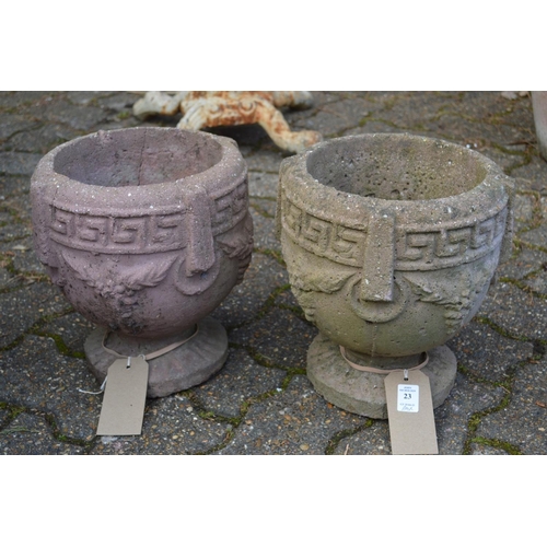 23 - A pair of small composite garden planters.