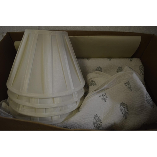 236 - An Oka throw and set of four pleated lamp shades.