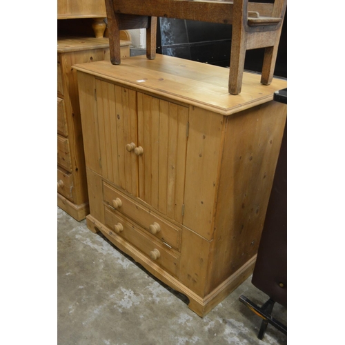 242 - A pine TV cabinet.