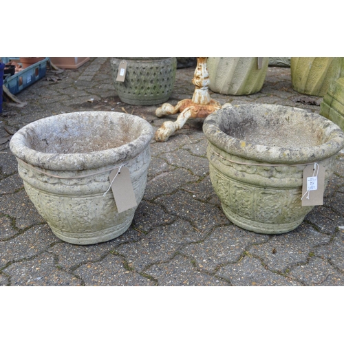 25 - A pair of composite garden planters.