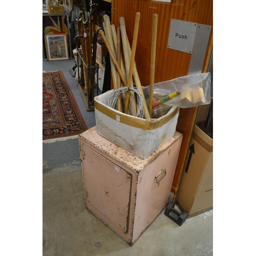 256 - Croquet equipment and an old tin storage cabinet.