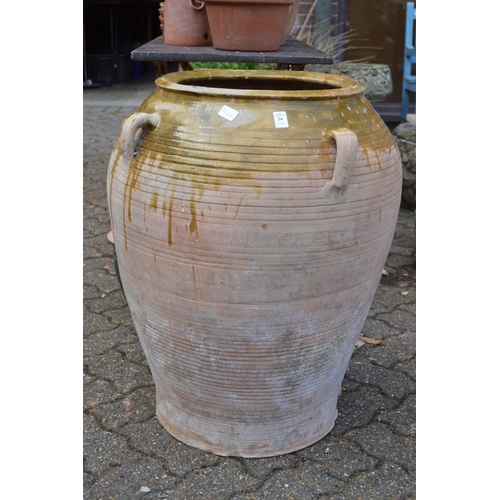 26 - A large Continental part glazed terracotta urn.